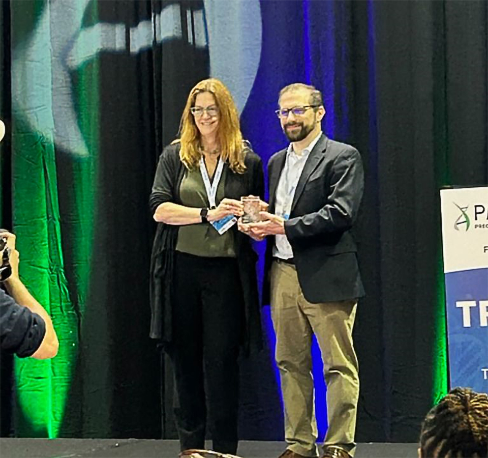 Dr. Philip Empey receiving award